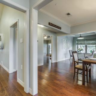 A modern dining area with hardwood floors and abundant natural light.