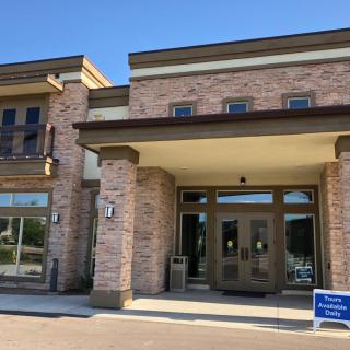 A modern brick commercial building with a prominent entrance.