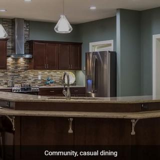 A modern kitchen setup with casual dining space.