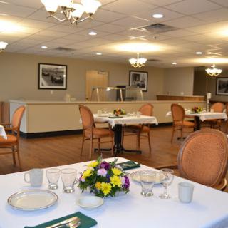 A warm and inviting dining room set up for guests.