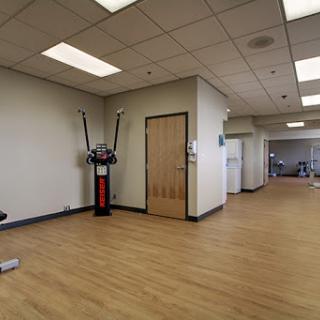 A spacious exercise room equipped for fitness activities.