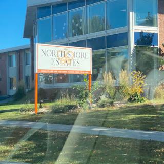 The exterior view of Northstore Estates with a clear sign indicating the name.