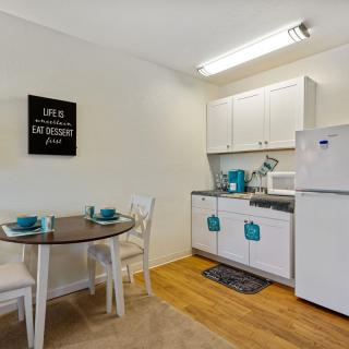 A compact kitchen and dining area in a modern apartment.