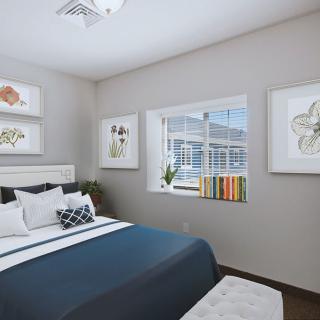A modern and minimalist bedroom with a neatly made bed, decorative artwork, and a window offering natural light.