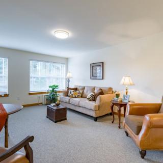 A cozy living room with comfortable seating and natural light.