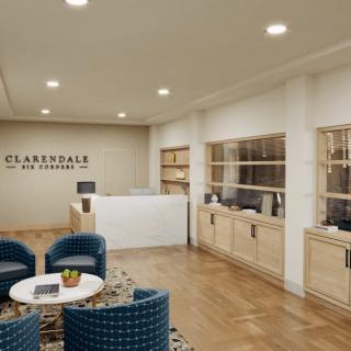 A modern and inviting office reception area with comfortable seating and a sleek desk.