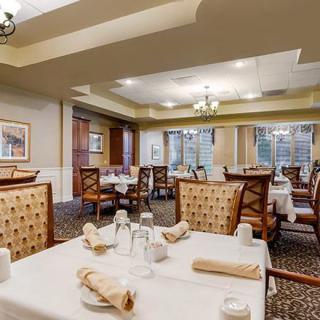 Elegant dining room with neatly arranged tables and chairs.