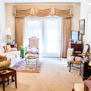 A traditional living room with elegant furniture and decor.