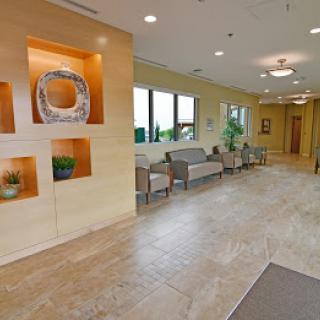 A modern lobby with comfortable seating and decorative elements.