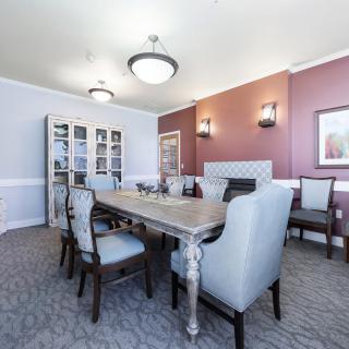 Elegant dining room with modern furniture and stylish lighting.