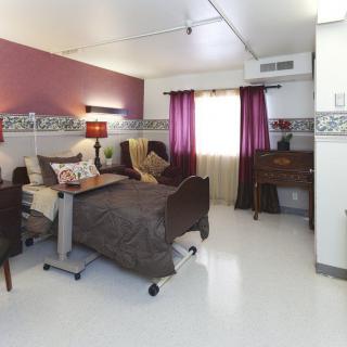 A well-appointed hospital room with patient beds and modern furnishings.
