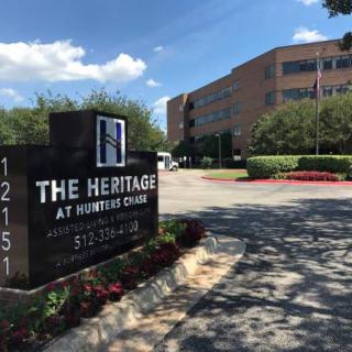 The entrance to The Heritage at Hunters Chase office complex on a sunny day.