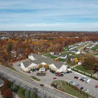 Aerial view of a residential neighborhood showcasing beautiful autumn foliage.