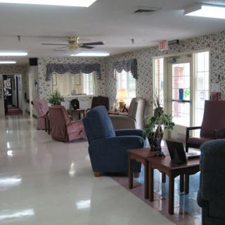 A comfortable community lounge area with seating and natural light.