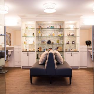 A modern interior with stylish shelving and seating.