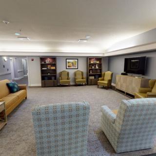 A cozy living room with comfortable seating and a television.