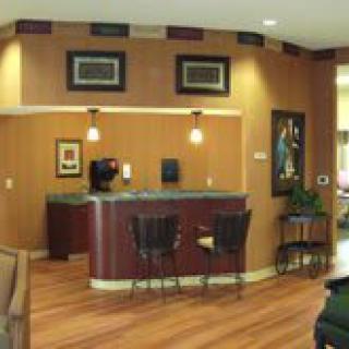 A cozy reception area with a counter and seating.