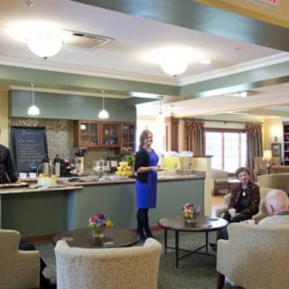 A cozy caf interior with people engaged in conversation.