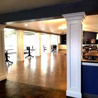 A modern and open office space with desks and chairs.