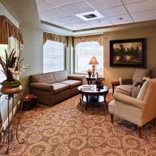 A cozy living room with comfortable seating and elegant decor.
