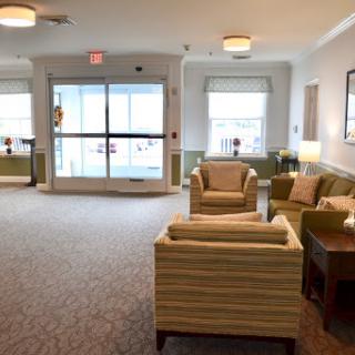 A cozy lobby area with comfortable seating and natural light.