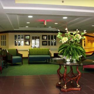 A welcoming lobby area with comfortable seating and decorative plants.