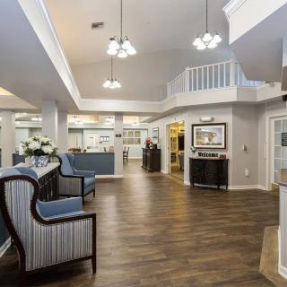 A spacious and well-lit lobby with comfortable seating and modern decor.