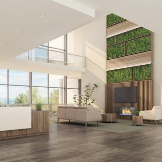 A spacious and modern living room featuring a fireplace, green accent wall, and large windows.