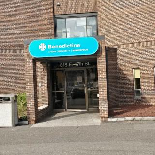 Entrance of a medical facility with a clear signage.