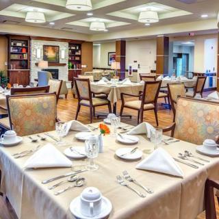 Elegantly set tables in a well-decorated dining room.