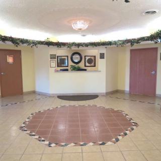 A spacious lobby with decorative tile flooring and a welcoming reception area.