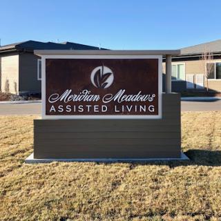 Sign for an assisted living facility, showcasing its welcoming nature.
