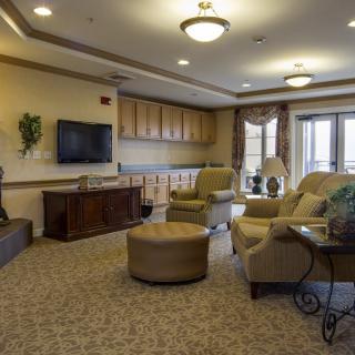 A cozy living room with comfortable seating and a television.