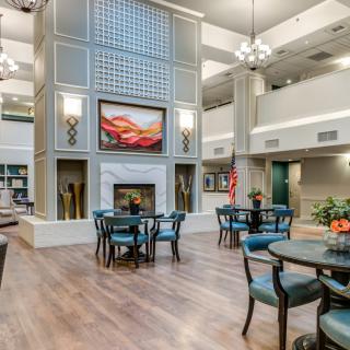 Spacious and elegant lobby with a cozy fireplace and comfortable seating.