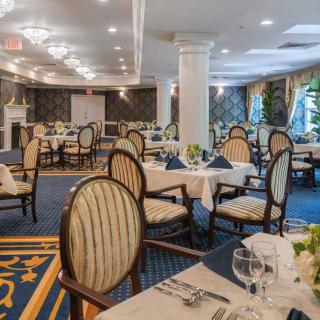 An elegant dining room with beautifully set tables and classic decor.