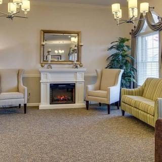 Elegant living room with a cozy fireplace and comfortable seating.