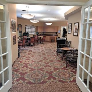 A view into a cozy lounge area, featuring comfortable furniture and inviting decor.