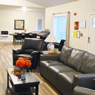 A modern living room with comfortable seating and stylish decor.