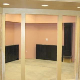 A modern, empty office space with glass walls and minimalistic design.