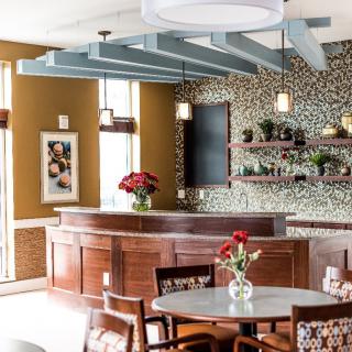 A cozy bar interior with elegant decor and furnishings.