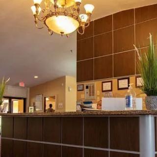 A warm and inviting hotel reception area with elegant lighting and decor.