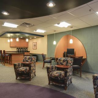 A cozy lounge area with modern furniture and a relaxed atmosphere.