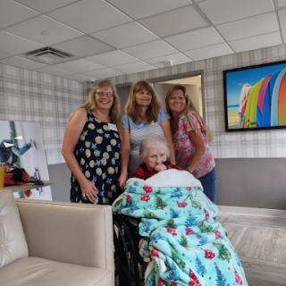 A joyful gathering with loved ones at the nursing home.
