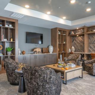 A modern living room with stylish decor and comfortable seating.