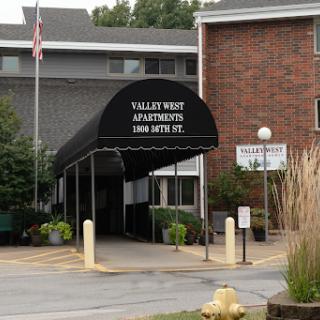 Entrance of Valley West Apartments with a welcoming canopy.