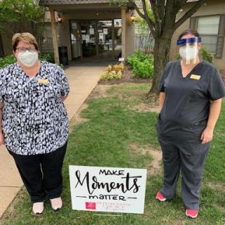 Healthcare staff members promoting 'Magical Moments' at their facility.
