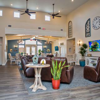 A modern living room interior with comfortable seating, stylish decor, and a warm atmosphere.