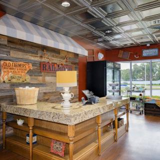 A rustic-themed restaurant interior featuring a wooden counter and various decorations.