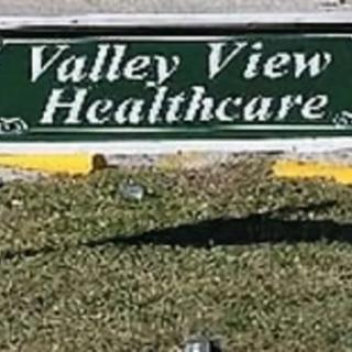 Valley View Healthcare sign on a grassy area.