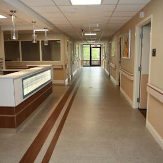 A view of a hospital corridor leading to the entrance.